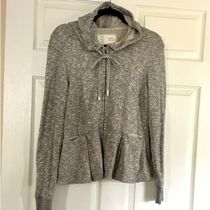 Lightweight jacket, jersey- type material, 2 small pockets, hooded.